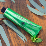 C.O. Bigelow men's shaving cream with eucalyptus oil formula packaging detailing.