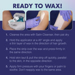 Satin Smooth non-woven cloth waxing strips and splinter-free wooden applicators laid out cleanly.