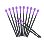 Professional makeup artist using G2Plus disposable lash spoolies
