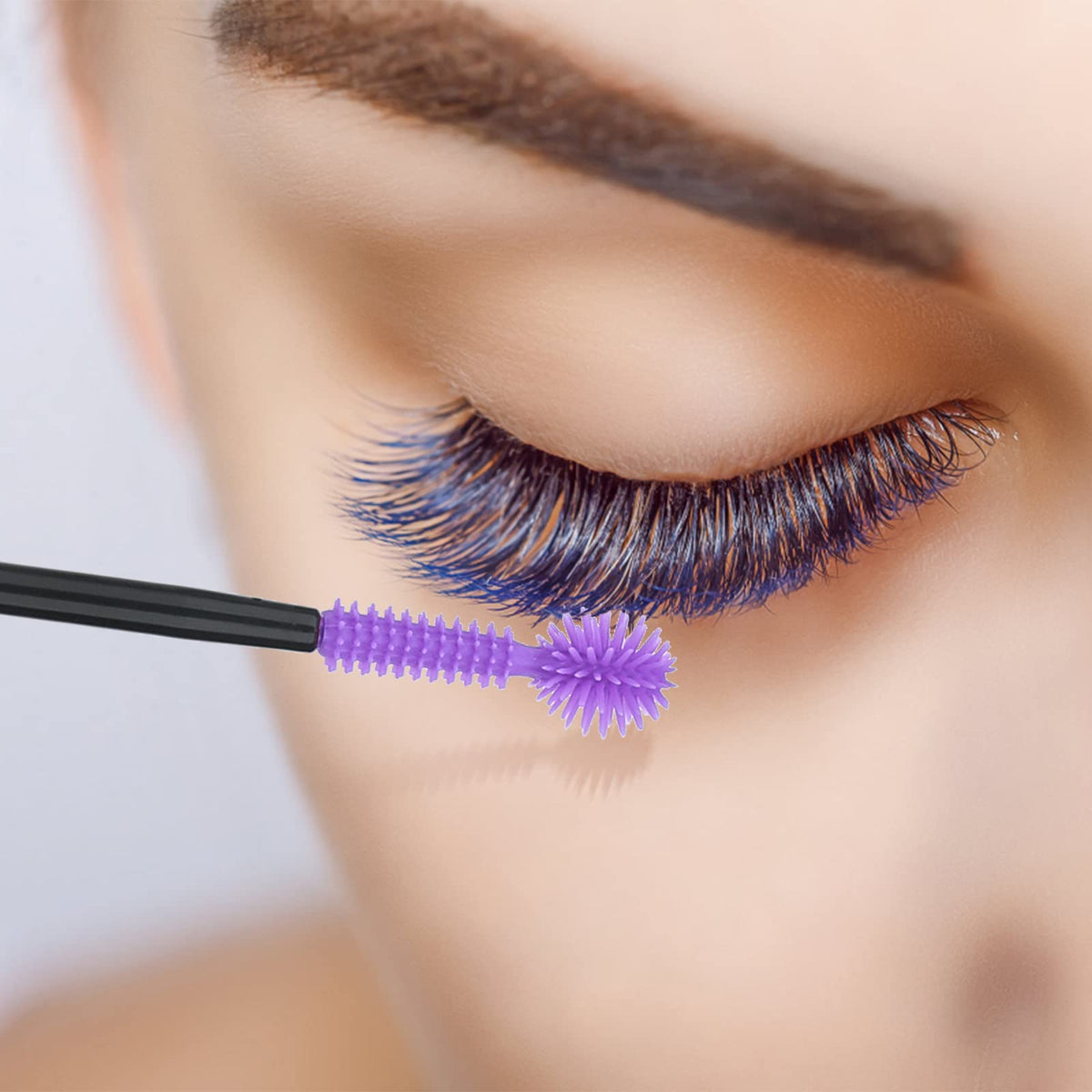 Top view of G2Plus disposable eyelash extension applicators in retail packaging
