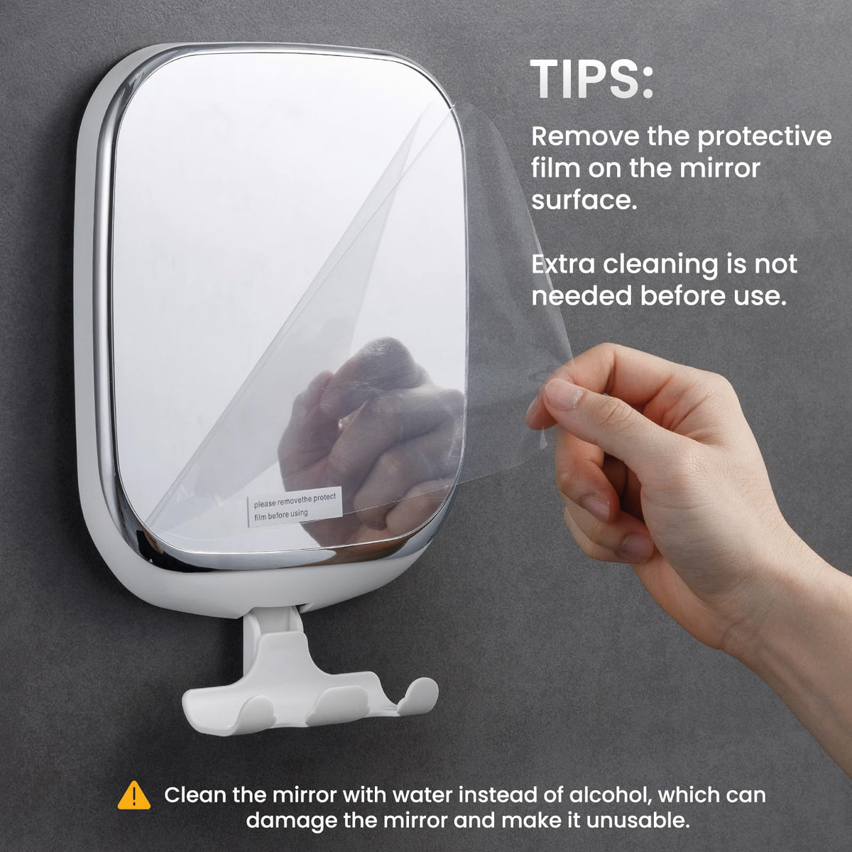 TAILI anti fog shaving mirror mounted on bathroom tile with a razor resting on the hook