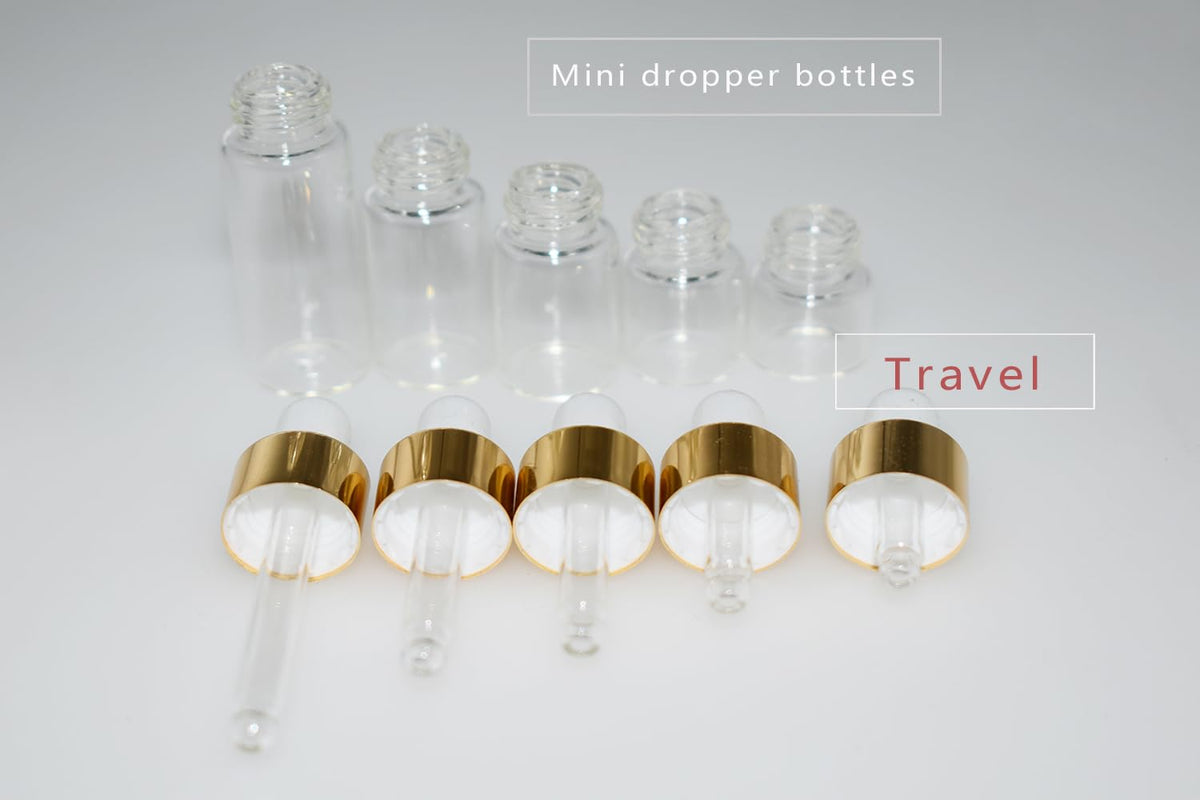 Clear glass dropper vials with gold caps for essential oils