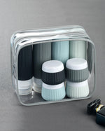 The complete Mrsdry travel size toiletries kit displayed next to a carry on suitcase to demonstrate its compact size and portability.