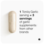 Two vegetarian garlic capsules resting next to the authentic imported wellness bottle.