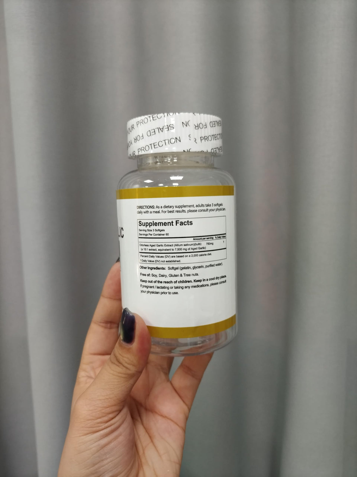 Secure packaging of authentic RTQSU premium aged garlic extract softgels.