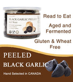 Orgnisulmte premium peeled black garlic cloves showing the soft date like texture