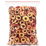 Hollow circle dried hawthorn berries close up showing bright red peels