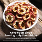 Slices of seedless dried hawthorn fruit on a wooden spoon