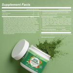 Vital Supergreens container next to fresh green wellness ingredients
