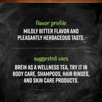 Brewed cup of organic nettle leaf tea with loose herbs