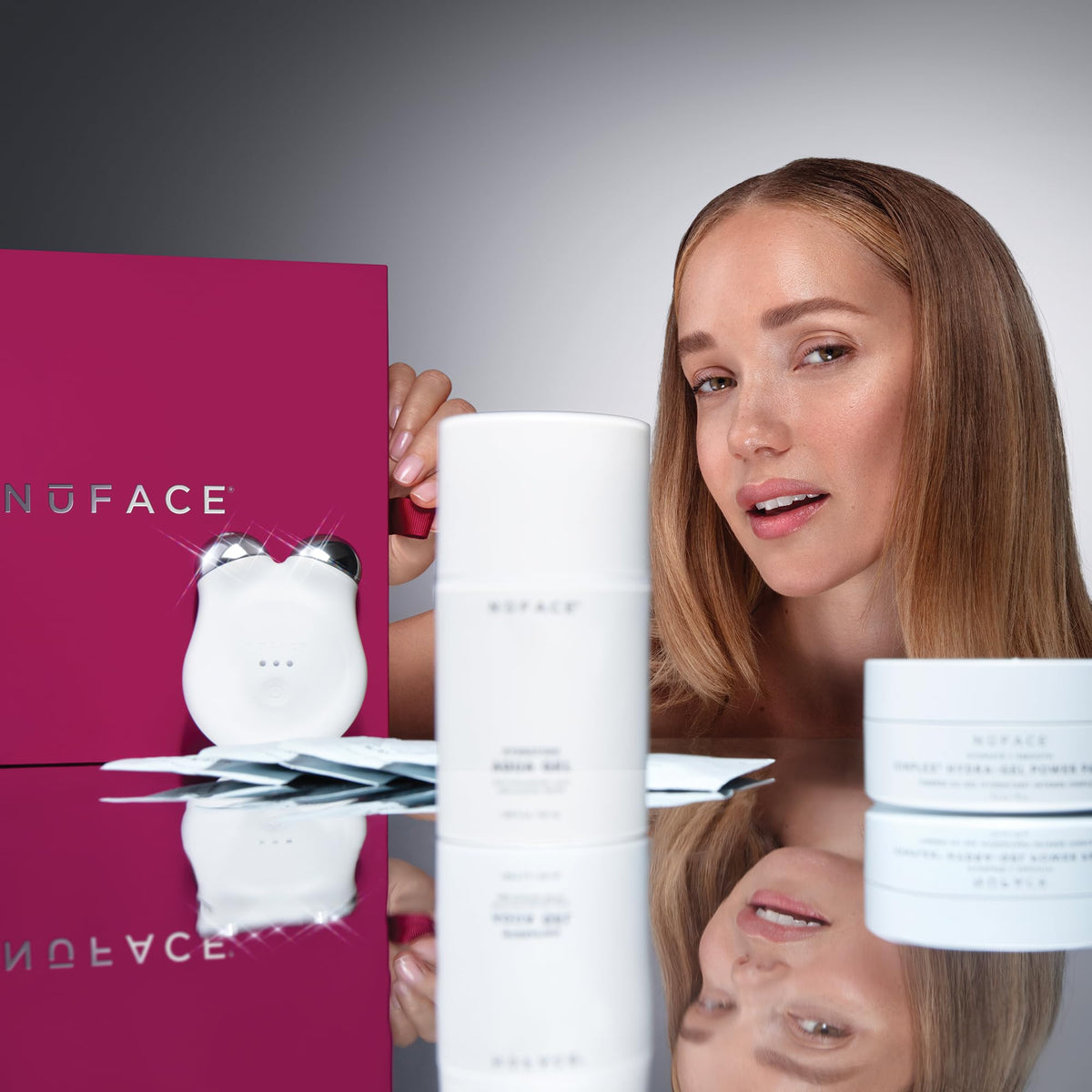 NuFACE MINI+ facial sculpting device displaying its premium white aesthetic and ergonomic spheres.