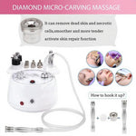 Professional diamond dermabrasion facial device with sterile diamond wands and vacuum tubes.