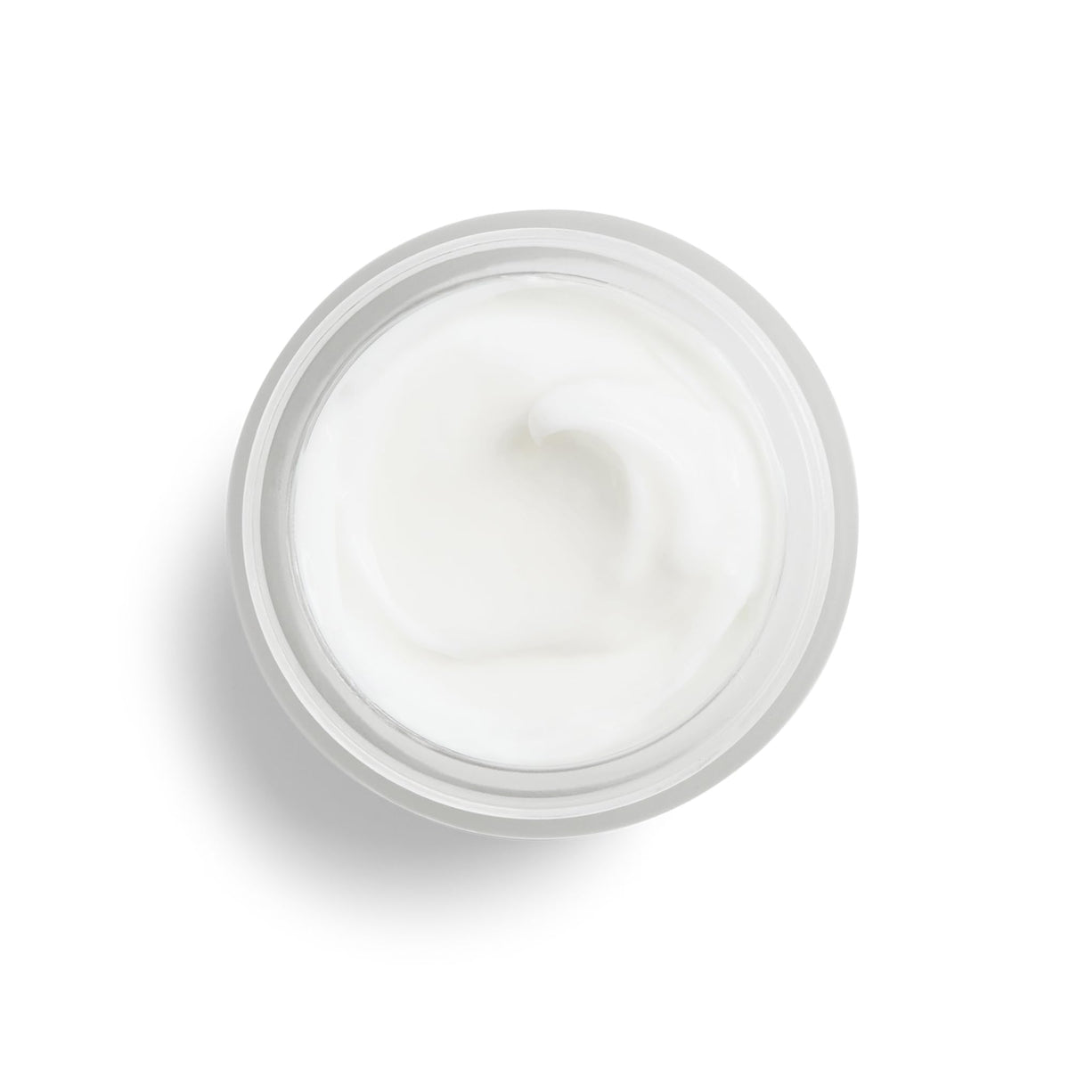 DHC skin renewing night cream placed on a clean vanity surface for nighttime routine