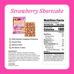 BelliWelli soft baked gluten free vegan snack bar next to fresh strawberries