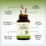 Herbal Roots organic valerian root capsules spilled next to the amber glass bottle showing vegan pills