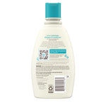 Aveeno Kids shampoo bottle next to bath accessories