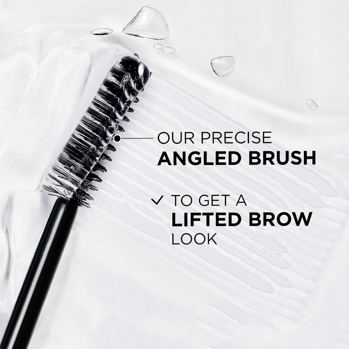 Transparent brow laminator gel brush showing fine bristles for styling