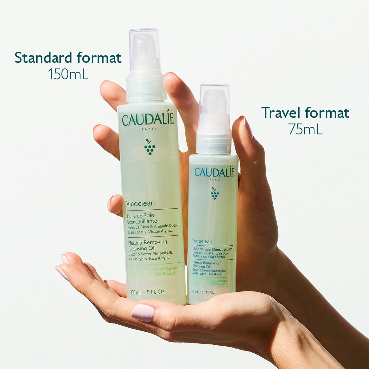 Authentic Caudalie cleansing oil bottle on white background