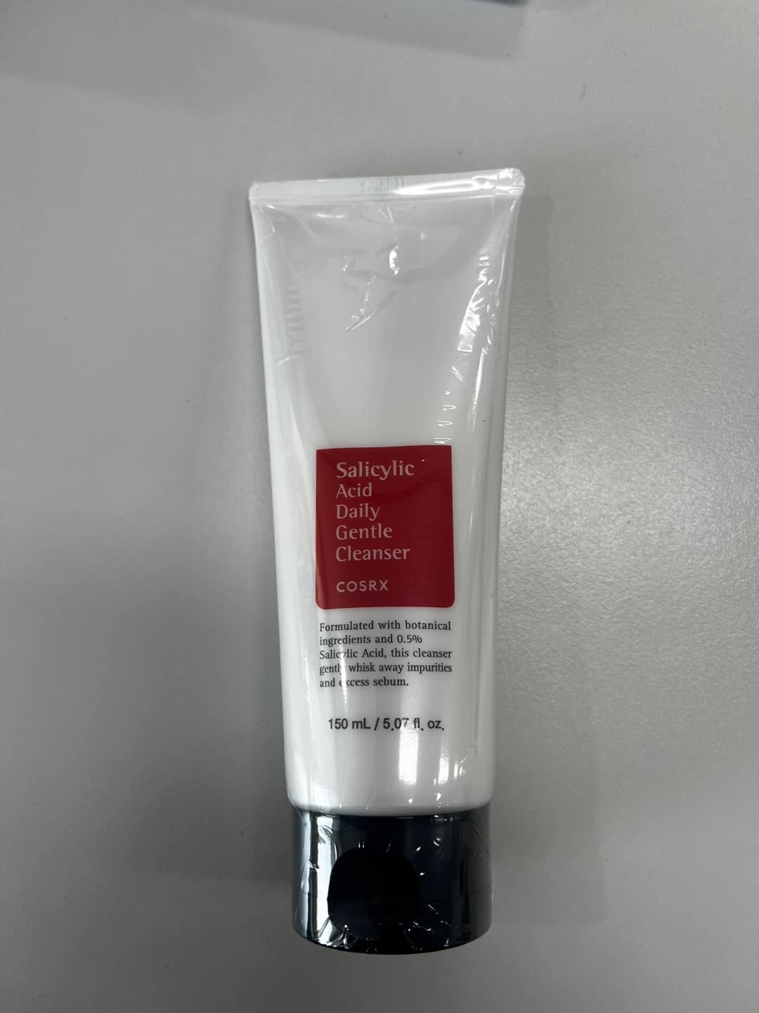 Cosrx BHA foaming face wash squeeze tube showing 150ml size.