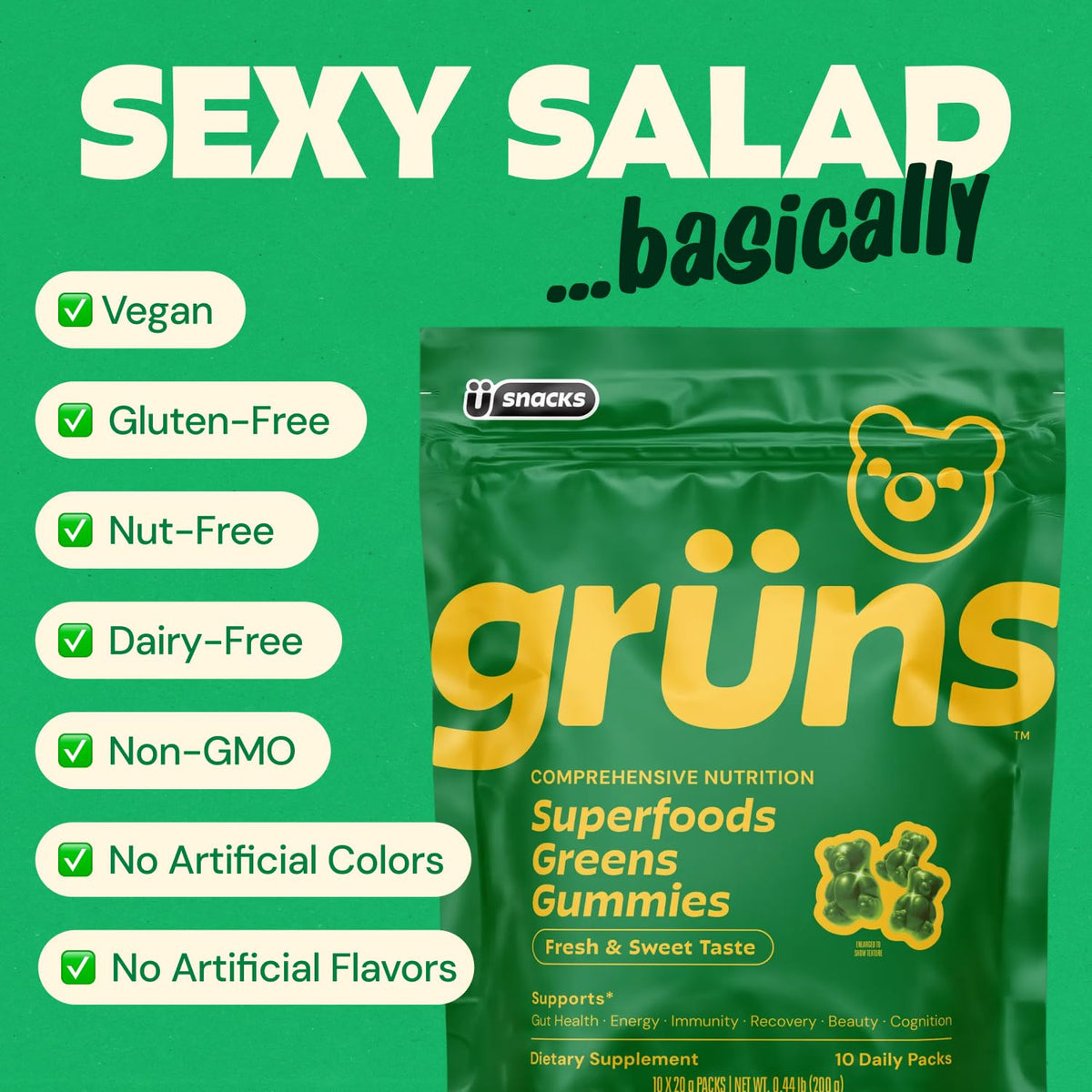 A single serving of Grüns multivitamin gummies held in a hand to demonstrate size and appetizing strawberry green texture.