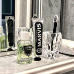 Marvis luxury mouthwash concentrate showing formula texture and green liquid hue