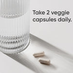 Side view of Sports Research vegan magnesium glycinate bottle showing non-GMO verified badges.
