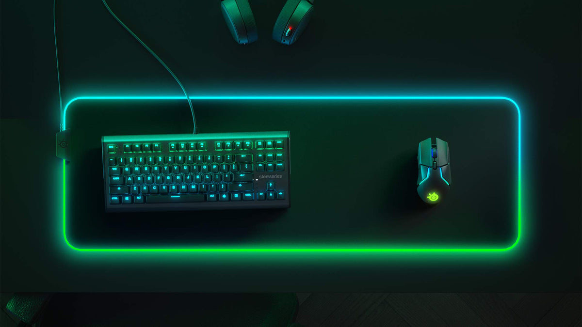 SteelSeries extra large desktop mouse pad with keyboard and mouse arranged on the micro-woven surface