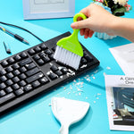 Compact Chengu tabletop dust pan and brush cleaning crumbs off a wooden desk