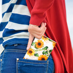 Vibrant sunflower theme pocket tissues arranged as party table hospitality supplies.