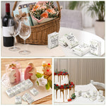 Sinmoe decorative eucalyptus themed ceremony tissues arranged on a guest welcome table.