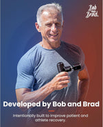 Bob and Brad Q2 Pro muscle massager with five interchangeable attachment heads organized on a surface