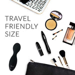 Compact lightweight VibeMax body massager next to its USB charging cable and travel pouch.