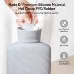 Premium food grade silicone hot water bag in upright position showing the stable flat base for safe filling.
