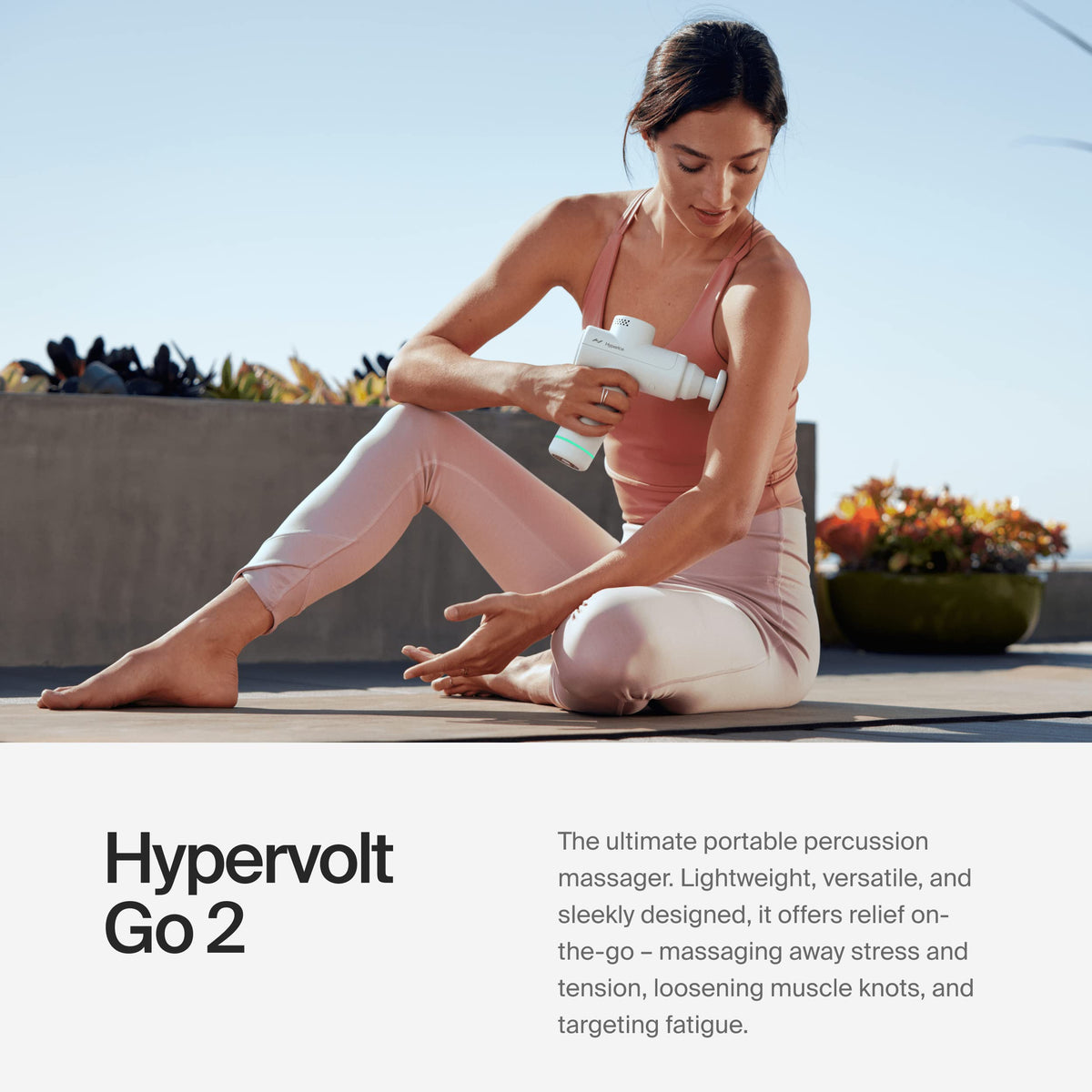 Hyperice Hypervolt Go 2 percussion massager side view showing ergonomic grip