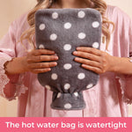 Lifestyle shot of HomeTop hot water bottle used for muscle pain relief