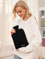 Back view of the Peterpan large scale heat therapy bottle with black knitted protective jacket