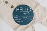 Close up of the engraved text and blue base accent on the premium birch wood circle.