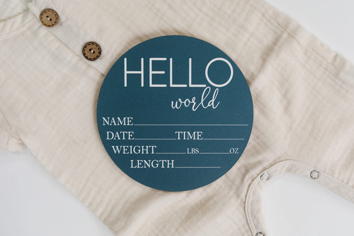 Close up of the engraved text and blue base accent on the premium birch wood circle.