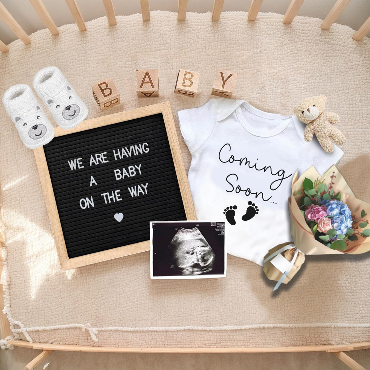 Ultrasound milestone photo frame and wooden blocks included in the pregnancy surprise set.
