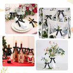 Riceshoot 50 Pieces Black Satin Ribbon Bows complete fifty pack set laid out for DIY craft decoration.