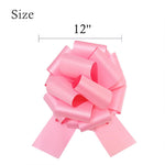 Authentic USA imported 12 inch pink glitter event decoration bow shown in flat packaging