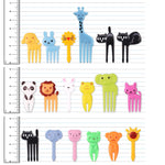 Multicolor cartoon lunchbox toothpicks being used to spear fresh fruit cubes and cheese snacks easily.