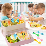 Vibrant mini animal fruit forks arranged cleanly to showcase giraffe panda and elephant designs
