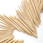 Compact toothpick holder with flip top lid open for one handed access