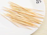 Wzrvmox airtight toothpick dispenser showing transparent base and colored lid structure