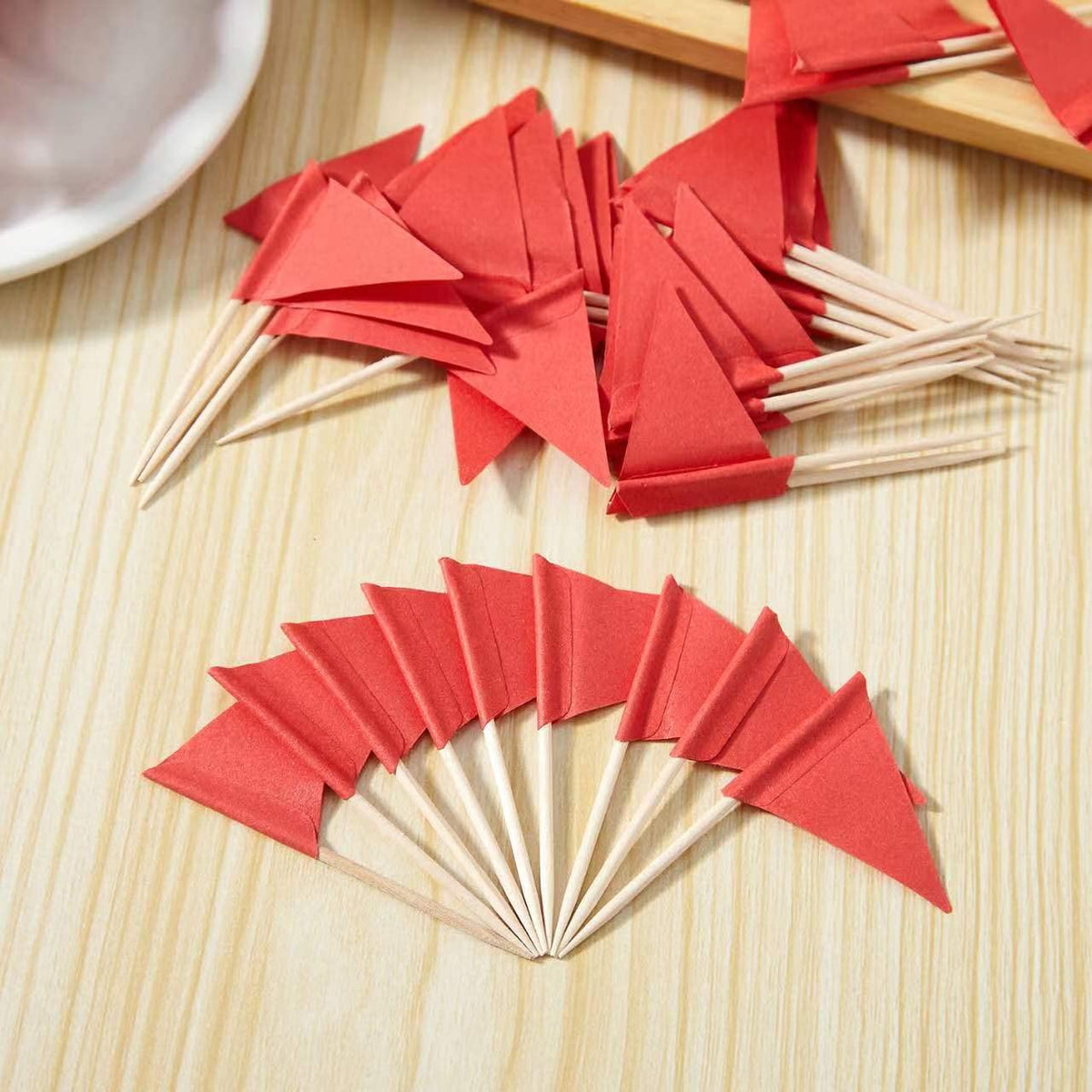 Natural wood and paper food markers displayed on a cheese board