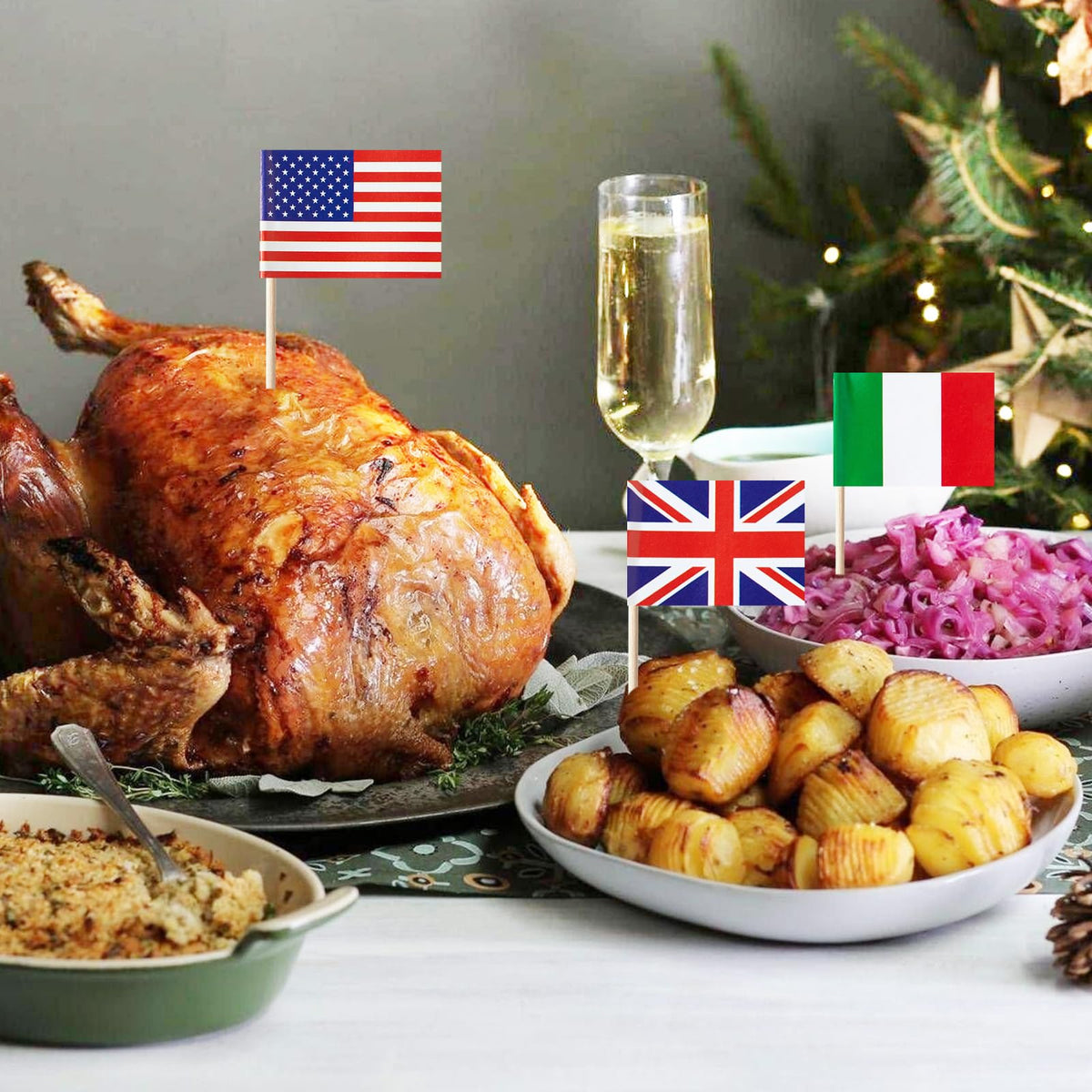 Premium international country flags on toothpicks inserted into fresh appetizers and cheese rolls for a festive party display