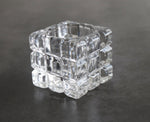 Weighted clear glass toothpick jar showing thick non-tip base structure with premium splinter-free bamboo toothpicks inside.
