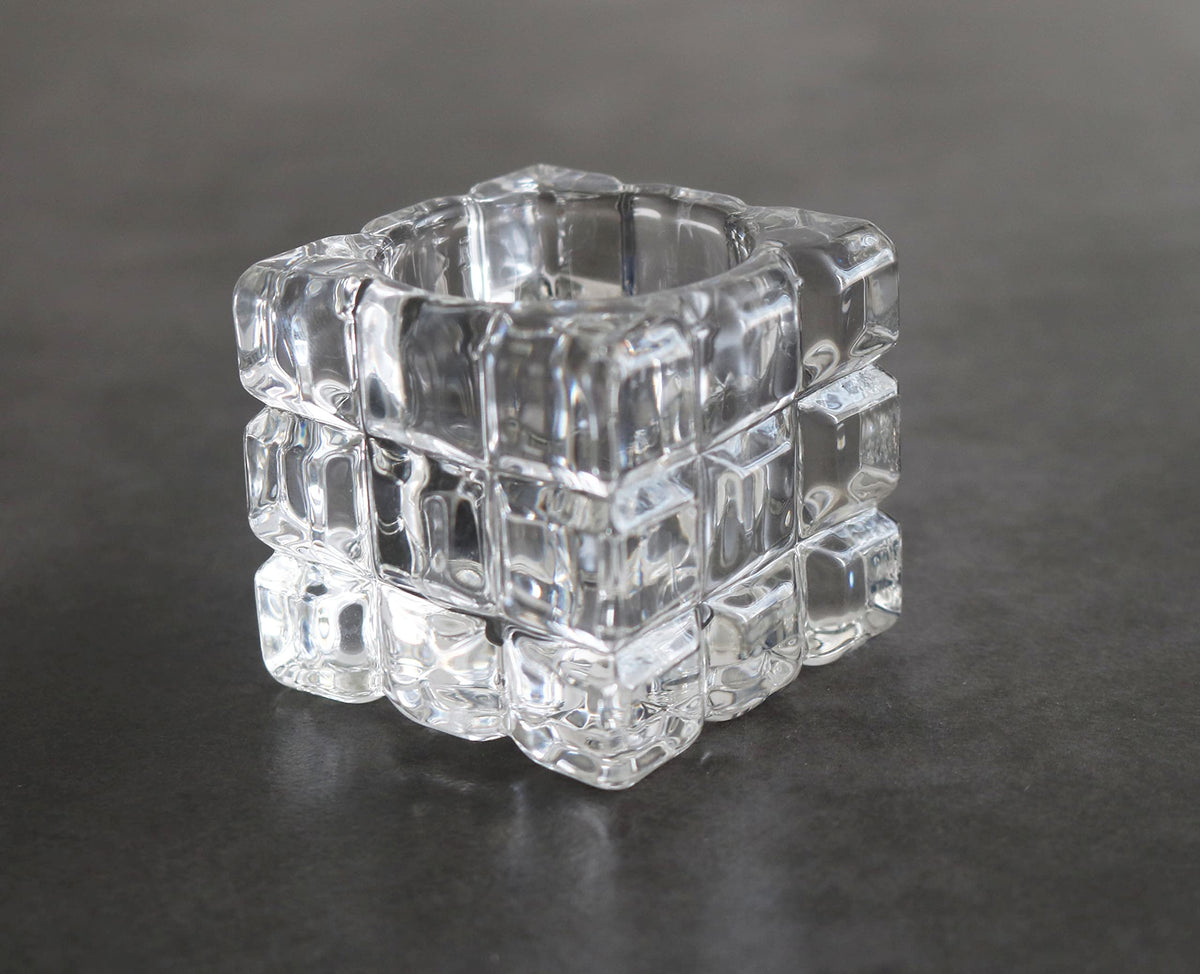 Weighted clear glass toothpick jar showing thick non-tip base structure with premium splinter-free bamboo toothpicks inside.