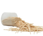 Authentic imported BambooMN toothpicks on a wooden dining table setting